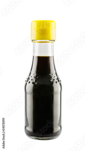 Soy sauce in glass bottle isolated on white background