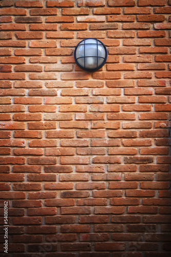 red brick wall and light lamp © stockphoto mania
