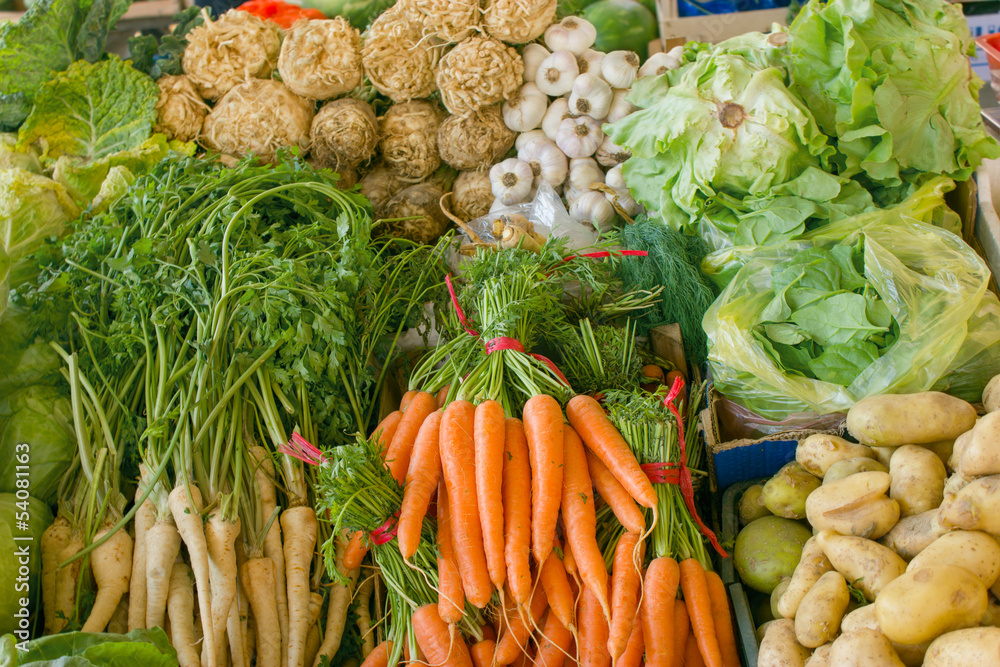 Fototapeta Fresh organic vegetables on the market stalls