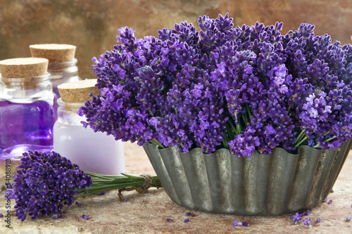 Bouquet of purple lavenders and spa products