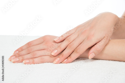 Beautiful woman hands with french manicure nails i
