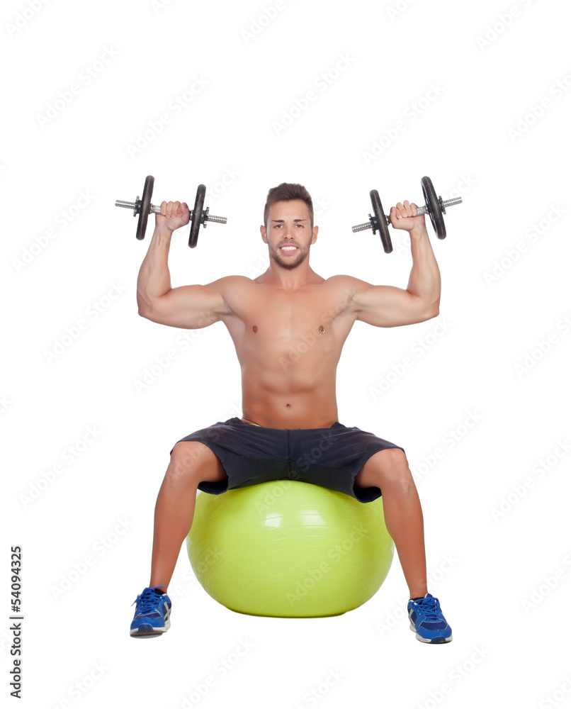 Strong man practicing exercises with dumbbells sit on a ball Strong man practicing exercises with dumbbells sit on a ball