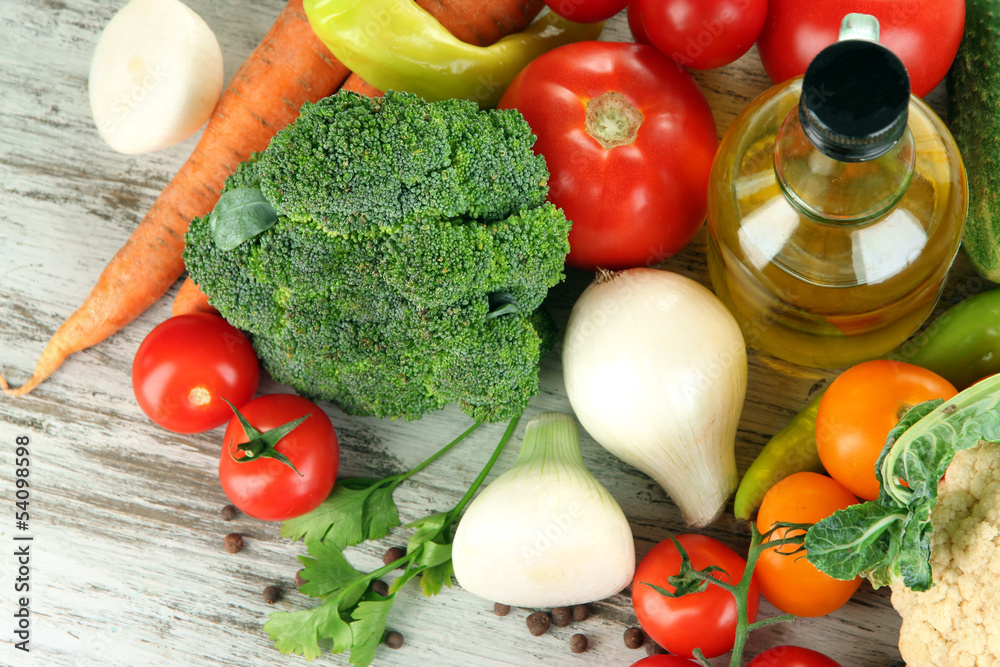 Fresh vegetables in basket on wooden table close-up Fresh vegetables in basket on wooden table close-up