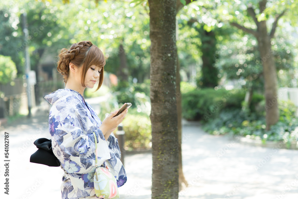Beautiful young woman wearing japanese traditional kimono Beautiful young woman wearing japanese traditional kimono