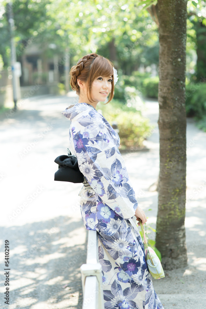 Beautiful young woman wearing japanese traditional kimono Beautiful young woman wearing japanese traditional kimono