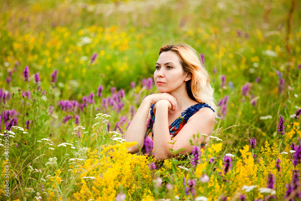 Beautiful Young Woman in outdoors, enjoying nature and smiling Beautiful Young Woman in outdoors, enjoying nature and smiling