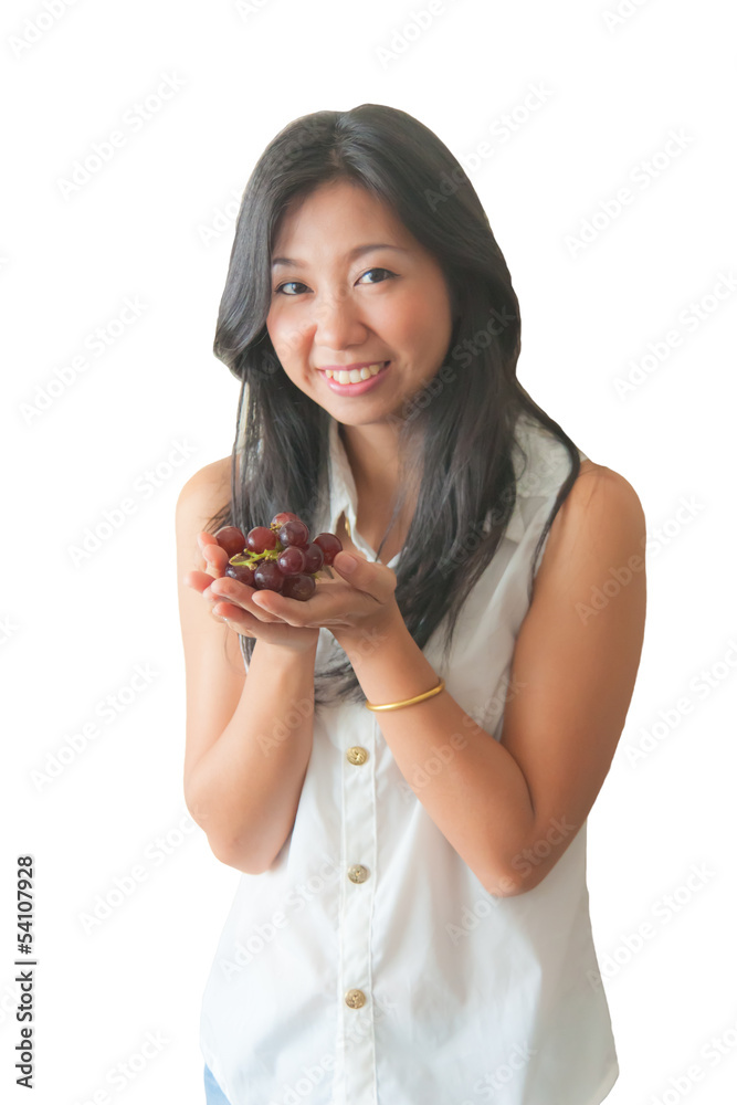 An Asian woman showing red grape, isolated on white background