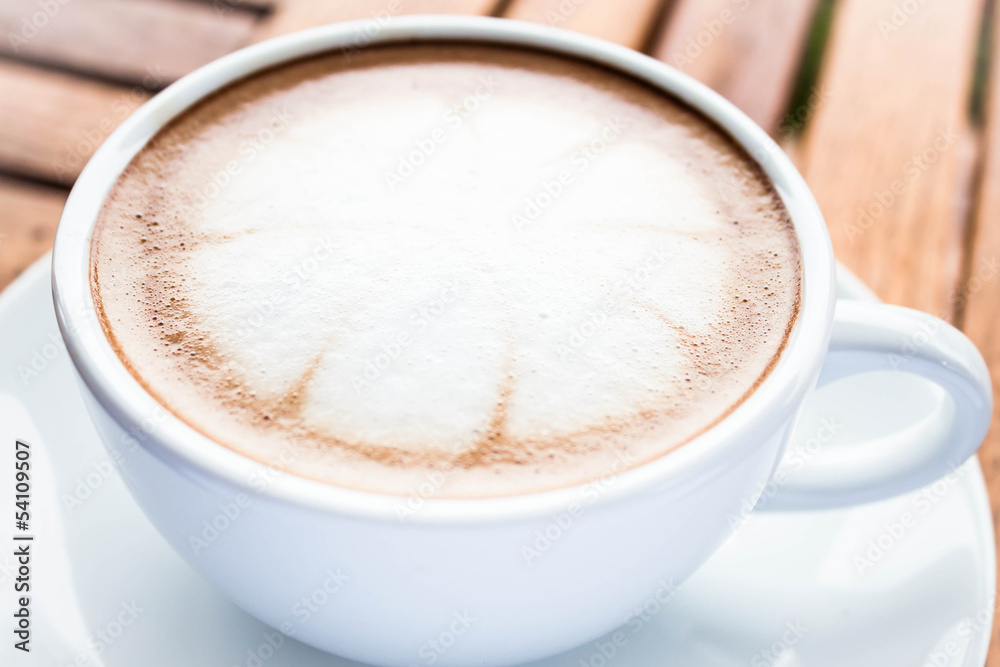 Serving cup of hot cafe mocha on wooden table Serving cup of hot cafe mocha on wooden table