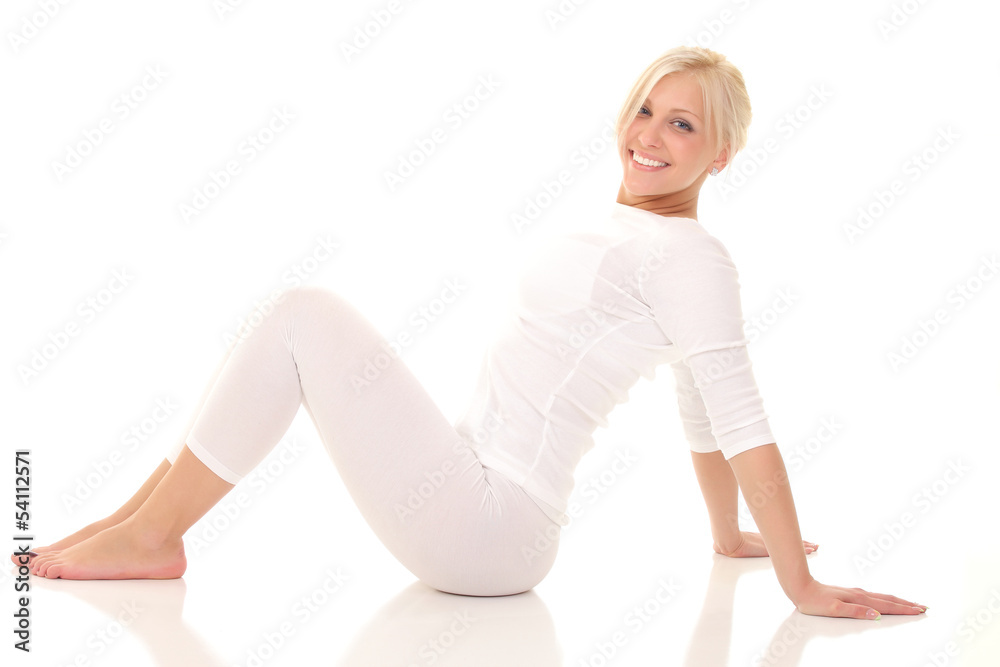 Young smiling woman sitting on the floor Young smiling woman sitting on the floor