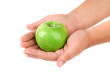 Granny Smith of apple from low perspective. Hand.