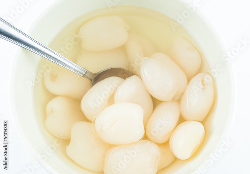 dessert rambutan in syrup on white background