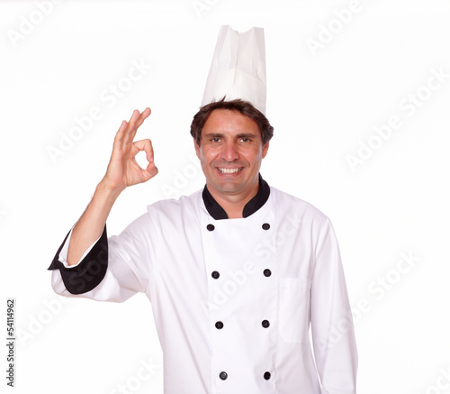 Charismatic male chef gesturing positive sign