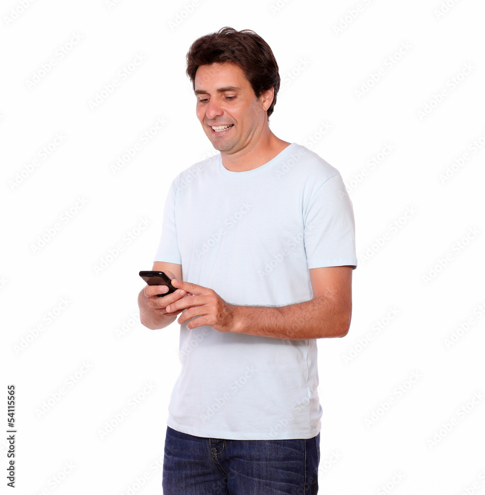 Charming guy sending a message on cellphone Charming guy sending a message on cellphone