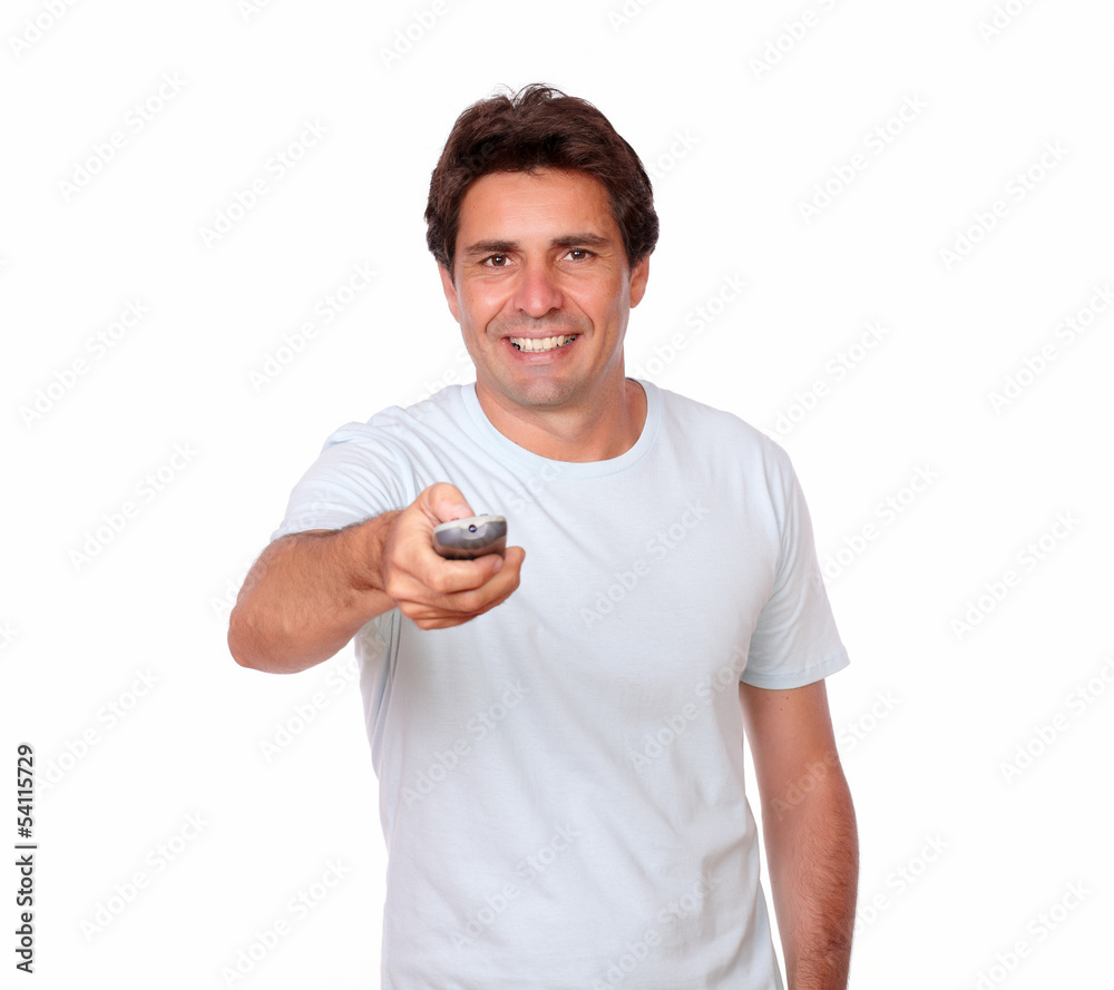 Charming latin man holding remote control Charming latin man holding remote control
