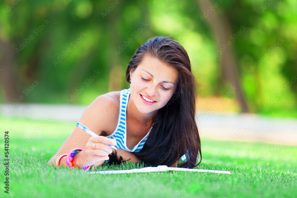 beautiful young brunette woman with note at outdoor beautiful young brunette woman with note at outdoor