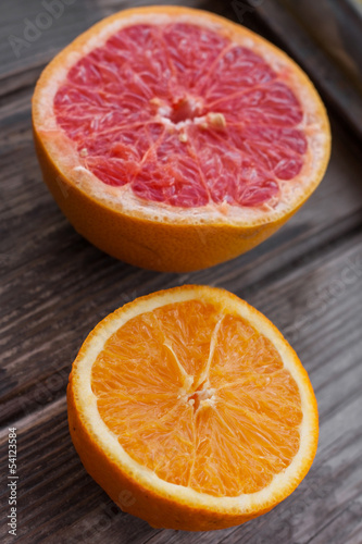 red grapefruit and orange on old table