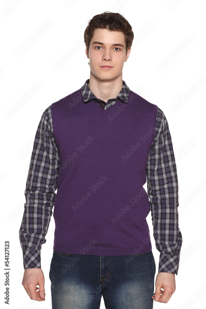 Fototapeta premium Front view of calm young man standing against white background
