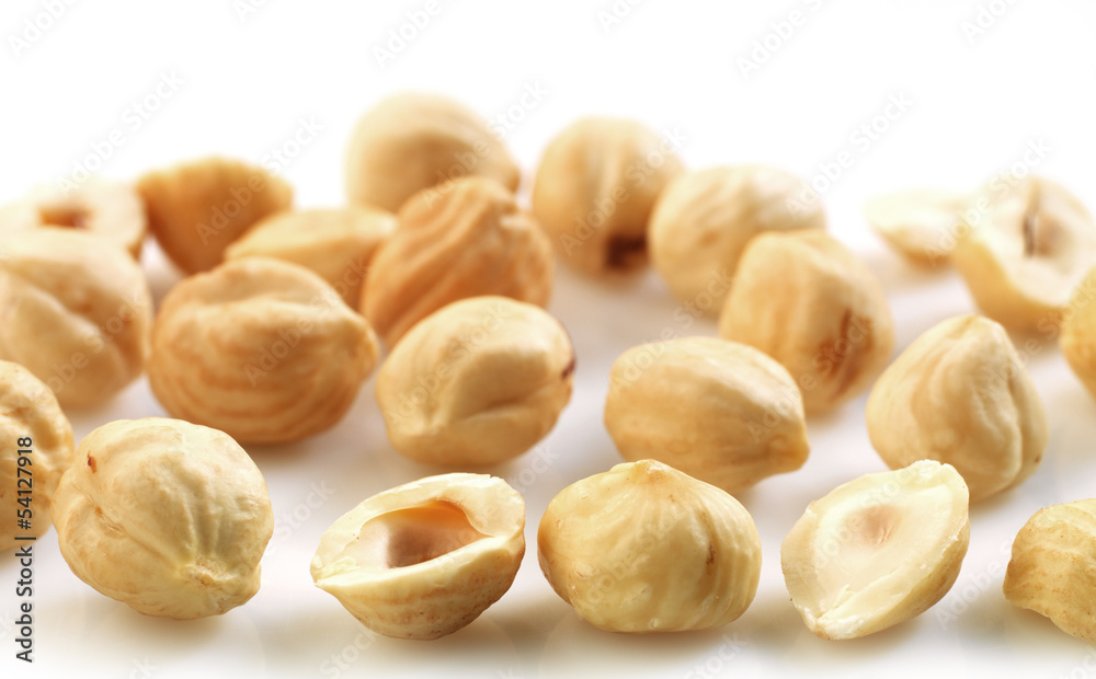 Closeup view of hazelnuts over white background Closeup view of hazelnuts over white background