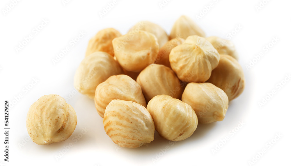 Closeup view of hazelnuts over white background Closeup view of hazelnuts over white background