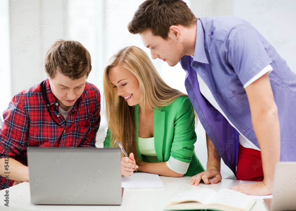students writing test or exam in lecture at school students writing test or exam in lecture at school