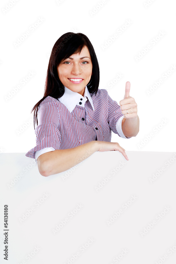 A smiling girl with a blank and showing ok A smiling girl with a blank and showing ok