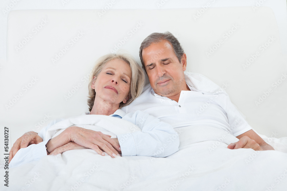 Happy Senior Couple On Sleeping Bed Happy Senior Couple On Sleeping Bed