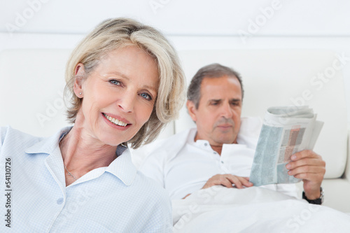 Happy Woman Sitting In Front Of Man