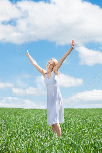 Happy Young Woman In Grassland