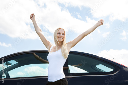 Woman Standing Near Car Raising Her Hand