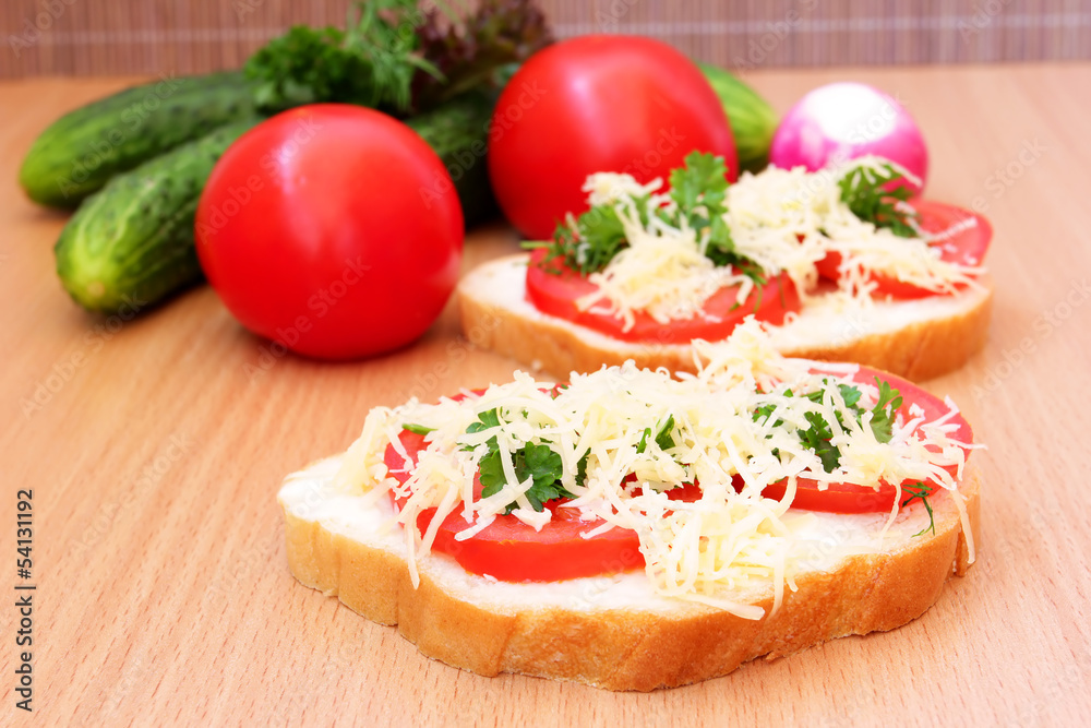 toast with tomato, cheese and greens