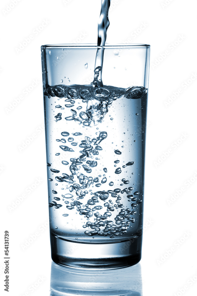 water pouring in glass isolated on white background water pouring in glass isolated on white background