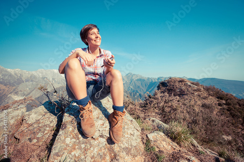 Young Woman at Top of Mountain