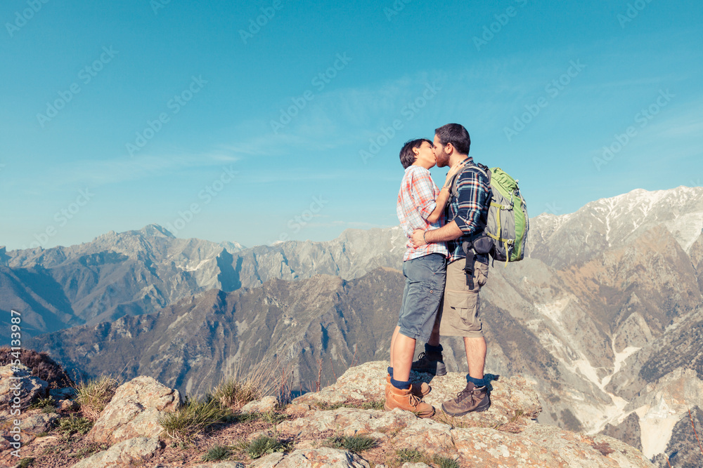 Couple Kissing at Top of Mountain