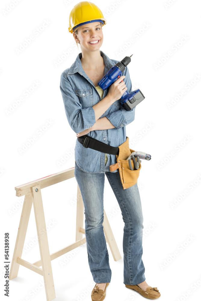 Female Construction Worker With Drill Standing By Work Horse