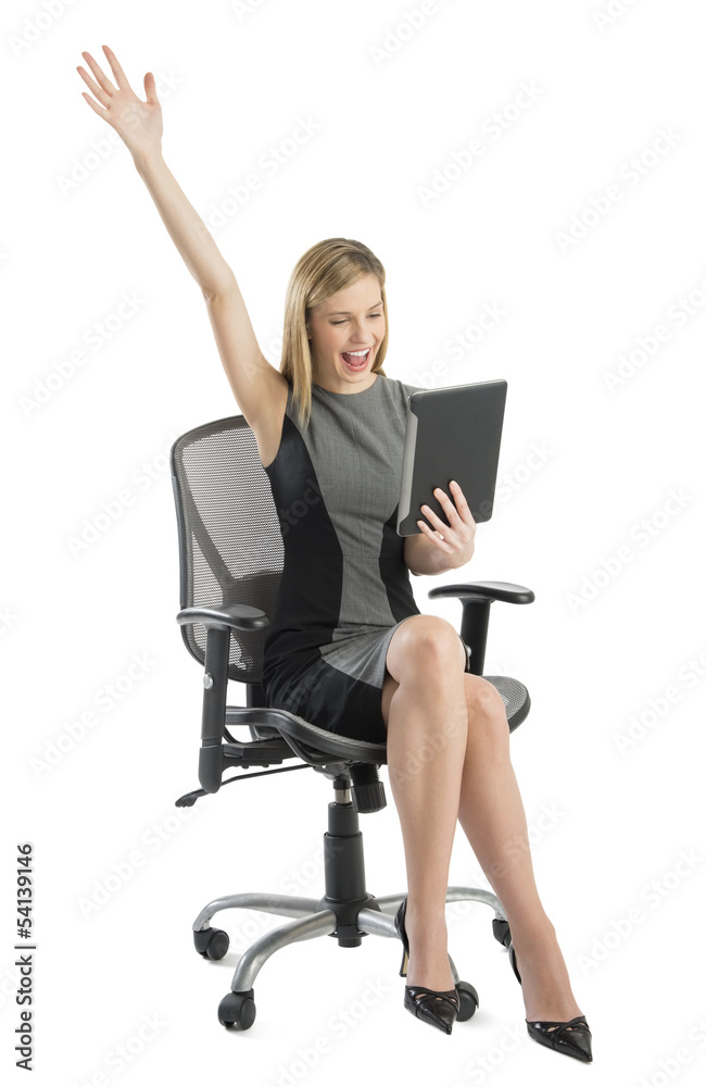 Businesswoman With Digital Tablet Celebrating Success While Sitt