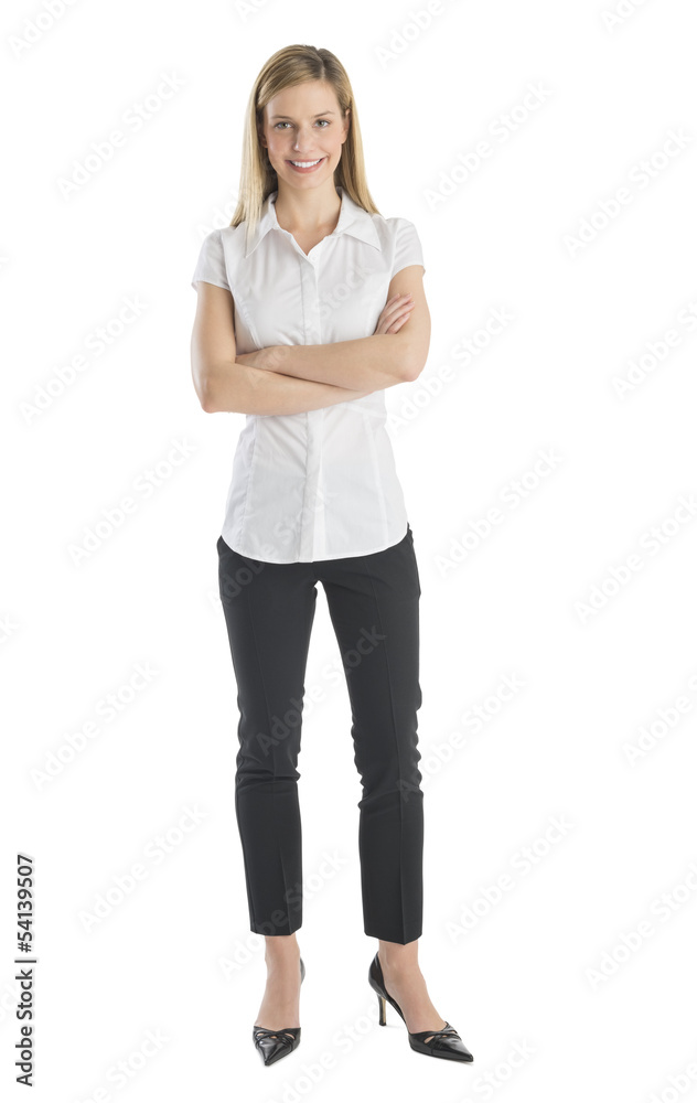 Young Businesswoman Smiling While Standing Arms Crossed Young Businesswoman Smiling While Standing Arms Crossed