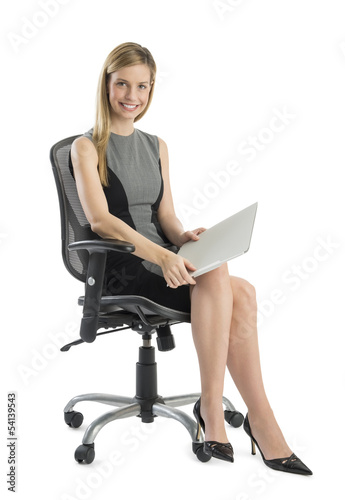 Young Businesswoman With File Sitting On Office Chair