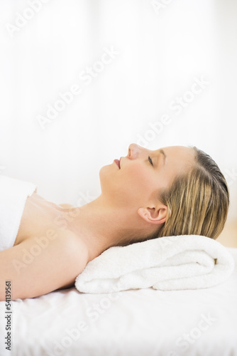Woman Sleeping On Massage Table At Health Spa