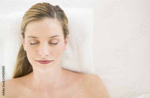 Beautiful Woman Relaxing On Massage Table At Health Spa