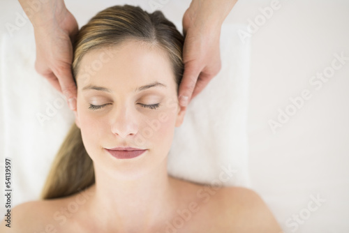 Attractive Woman Receiving Head Massage At Health Spa