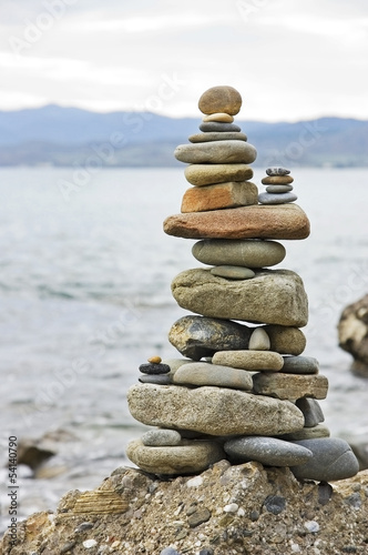 Balanced stack of stones on the seashore