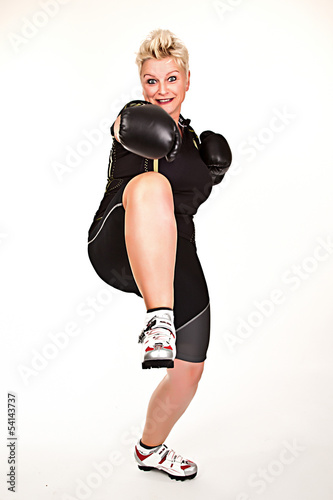 middelaged fitness woman boxing wearing boxing gloves and having © closeupimages