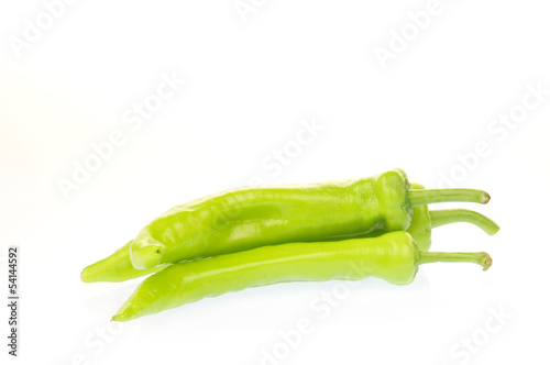 The green peppers on a white background