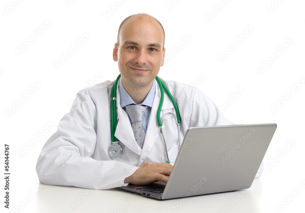 cheerful doctor sitting at the desk working on laptop cheerful doctor sitting at the desk working on laptop