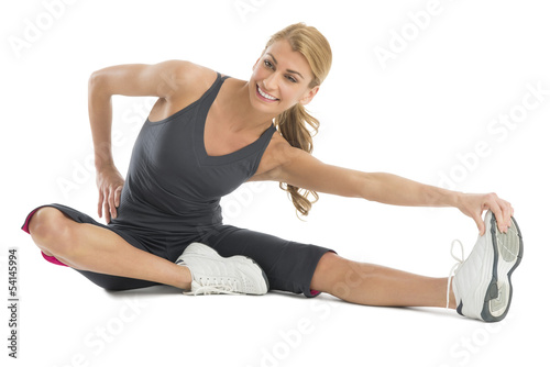 Beautiful Woman Stretching To Touch Her Toes