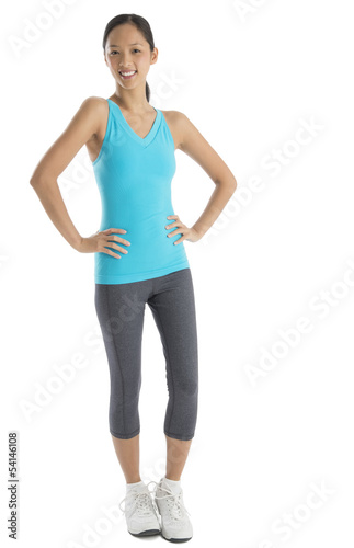 Fit Woman In Sports Clothing With Hands On Hips