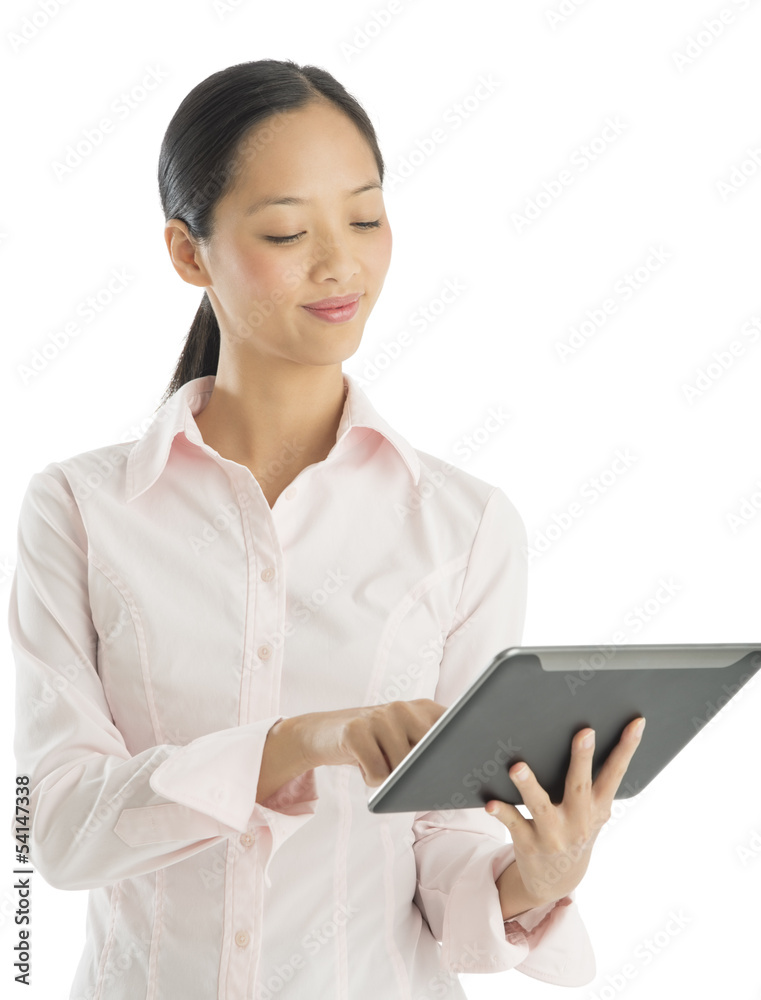 Businesswoman Smiling While Using Digital Tablet Businesswoman Smiling While Using Digital Tablet