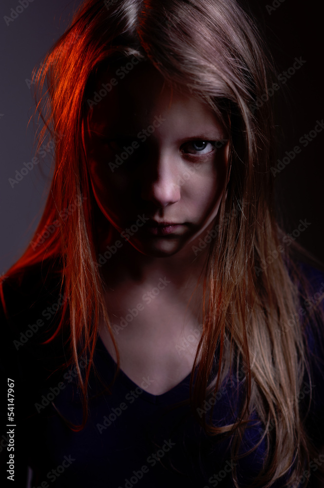 Closeup portrait of a scary little demon girl Closeup portrait of a scary little demon girl