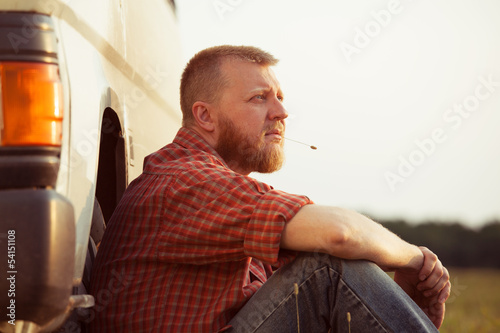 Red-bearded man on a summer evening photo