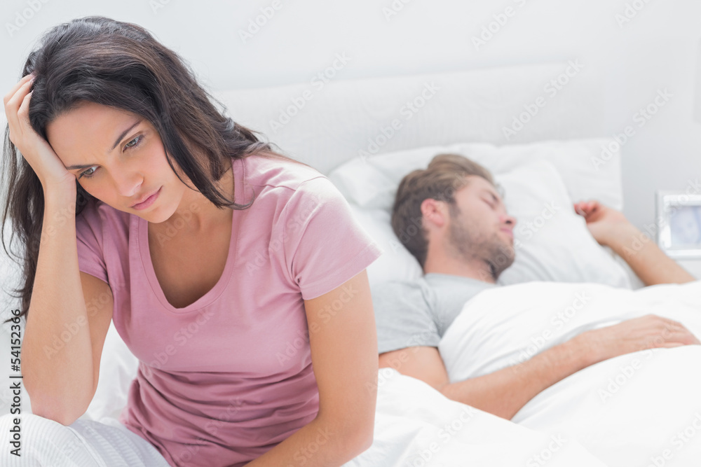 Anxious woman thinking in her bed Anxious woman thinking in her bed